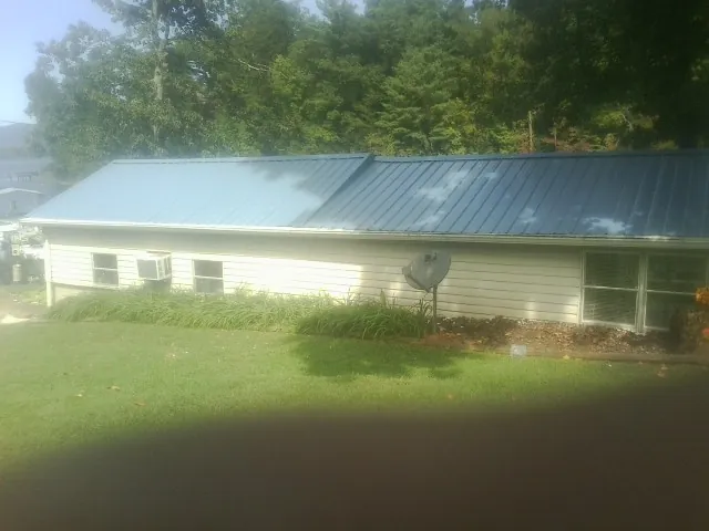 Blue metal roof running the length of a single story home in Henderson